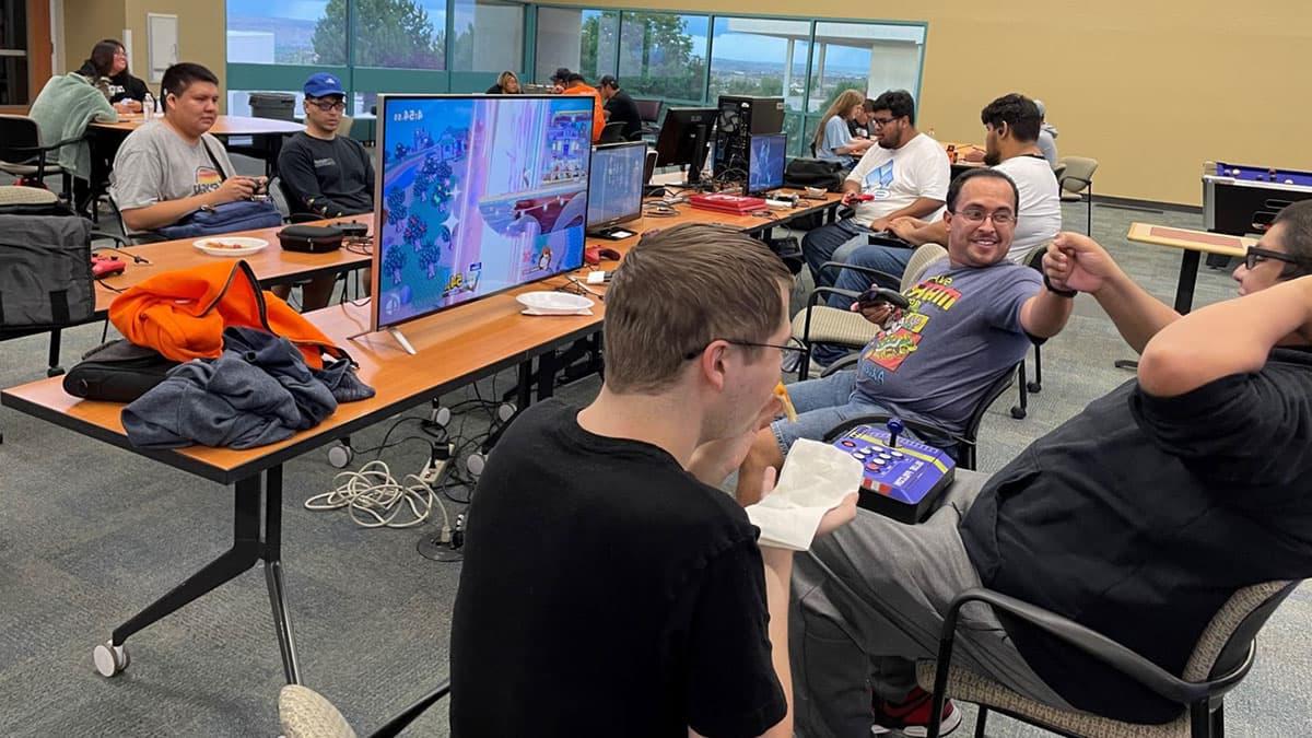 Group of students at tables for Geeks and Gamers